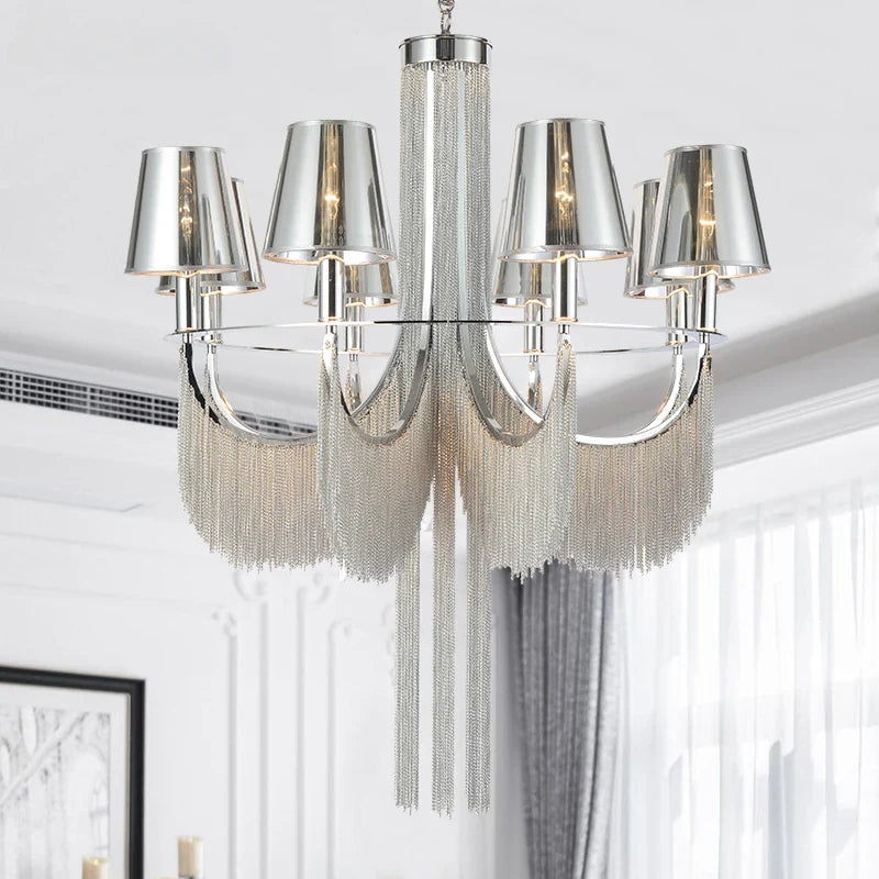 Glamorous chandelier illuminates wedding atmosphere.