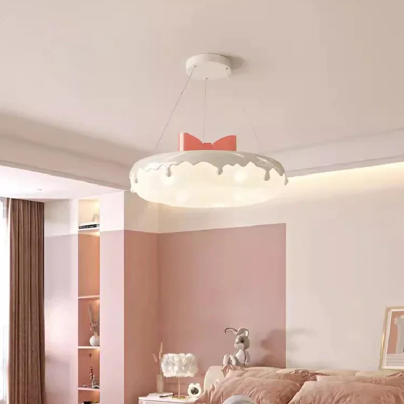 Donut-shaped chandelier with pink bow for children's decor