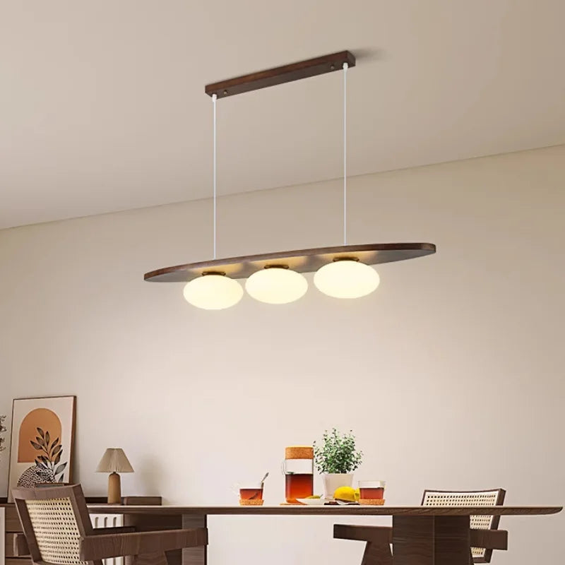 Solid wood chandelier on a sea of glass