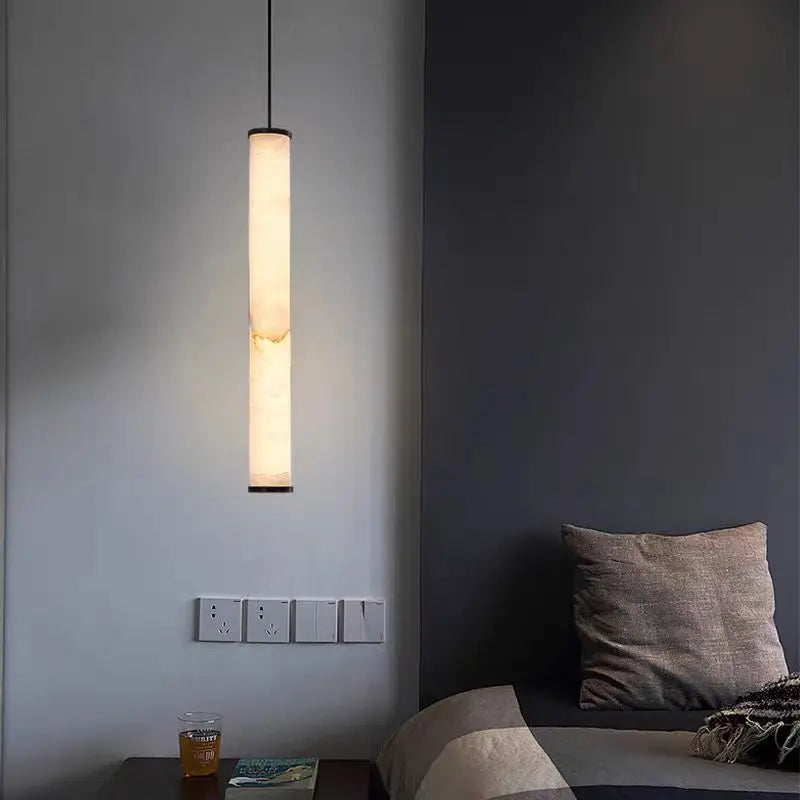 Cylindrical natural marble pendant light with adjustable cord
