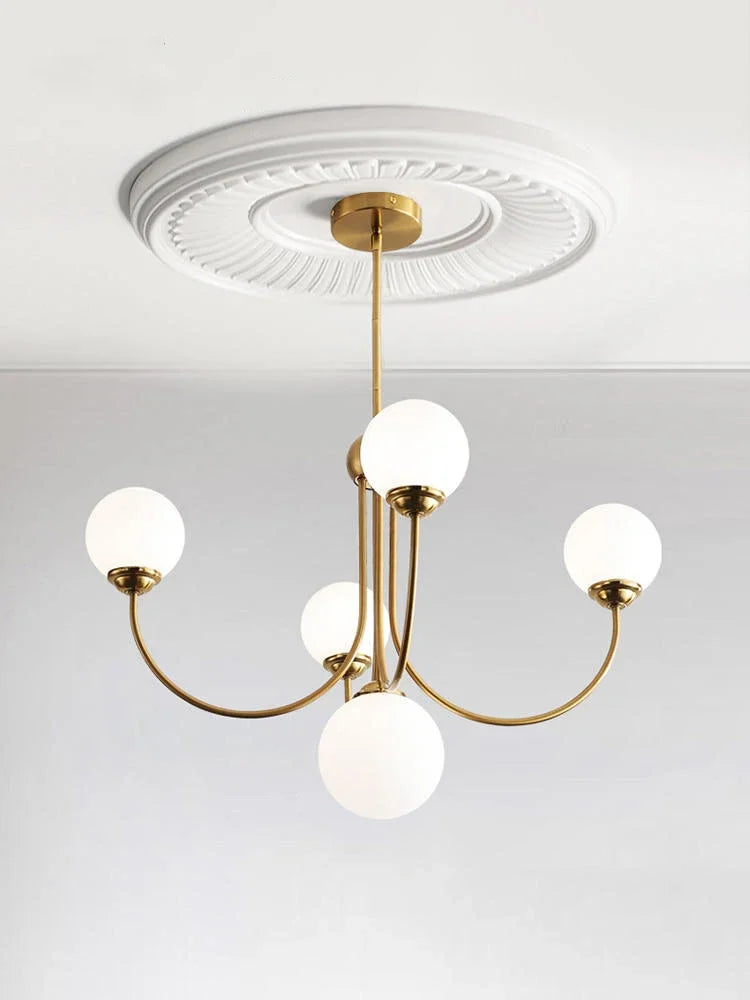 Retro chandelier illuminates contemporary decor.